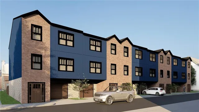 a car parked in front of a brick building