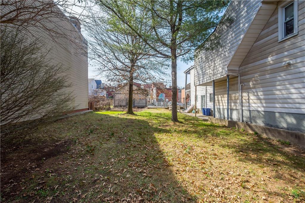 853 Spring Garden Avenue Pittsburgh, PA 15212 - Photo 13 of 20 a view of a yard with a house