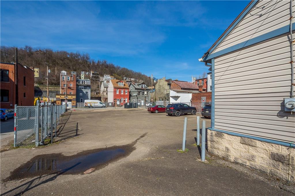853 Spring Garden Avenue Pittsburgh, PA 15212 - Photo 17 of 20 a city street lined with tall buildings