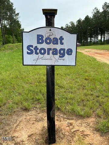 a street sign that is sitting on a brick wall