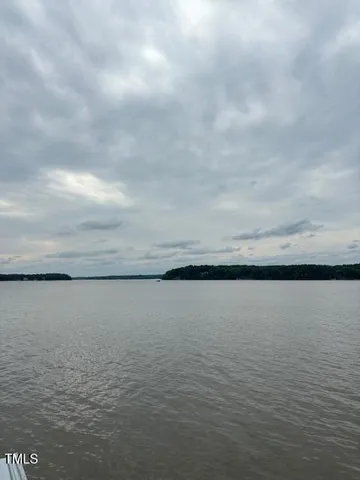 a view of a swimming pool with a yard
