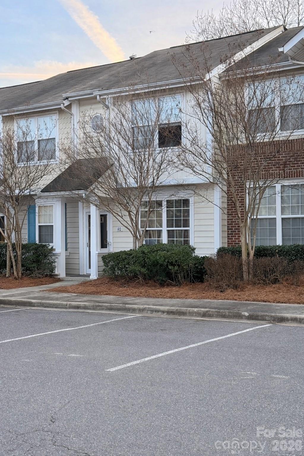 front view of a house with a small yard