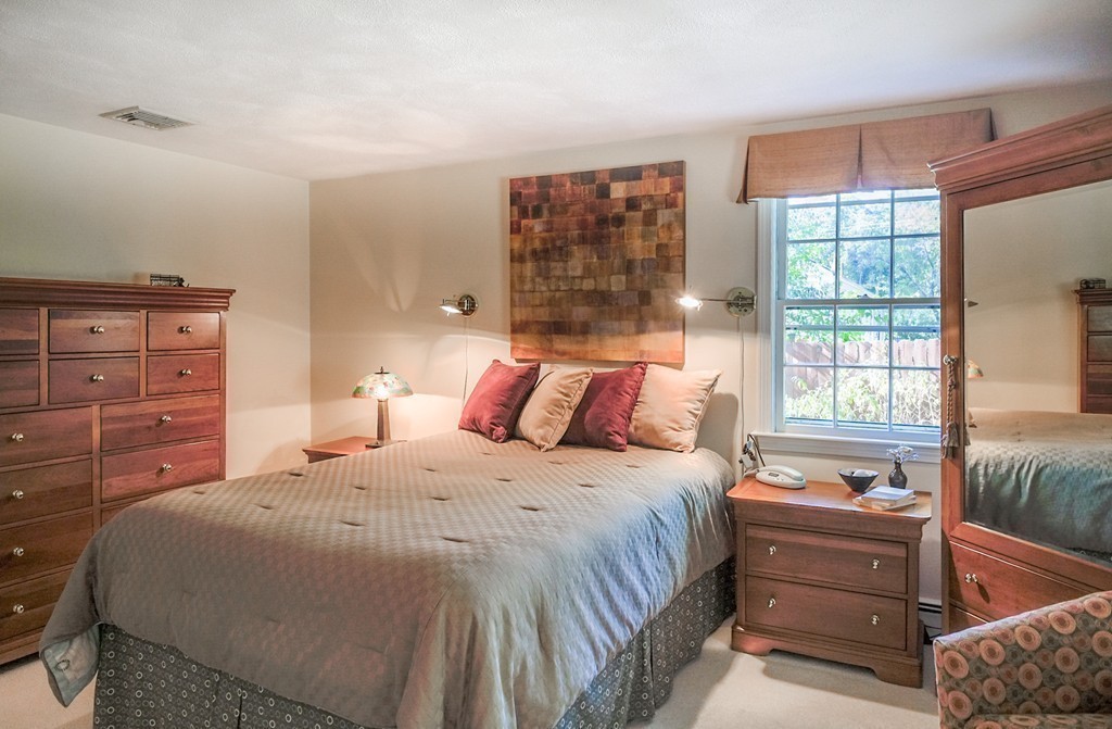 25 Oak Hill Road Wayland, MA 01778 - Photo 15 of 30 a bedroom with a large bed and a window
