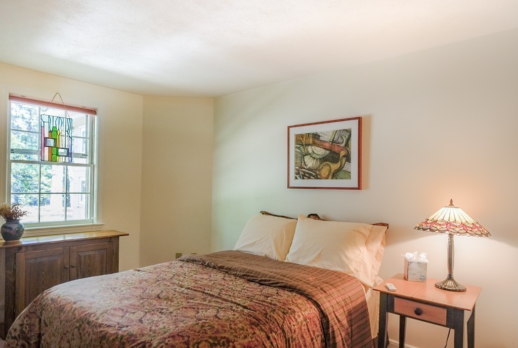 25 Oak Hill Road Wayland, MA 01778 - Photo 18 of 30 a bedroom with a bed and a window