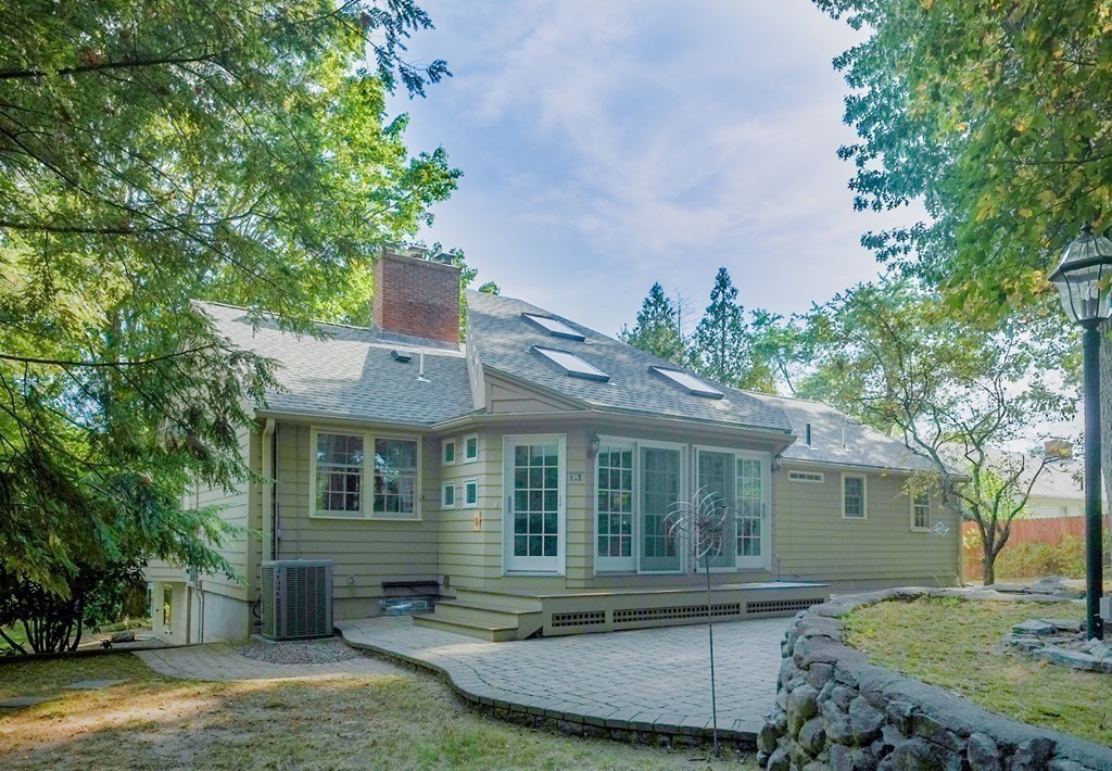 25 Oak Hill Road Wayland, MA 01778 - Photo 26 of 30 front view of a house with a yard