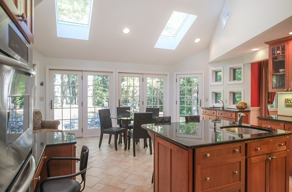 25 Oak Hill Road Wayland, MA 01778 - Photo 3 of 30 a dining hall with stainless steel appliances granite countertop a sink and cabinets