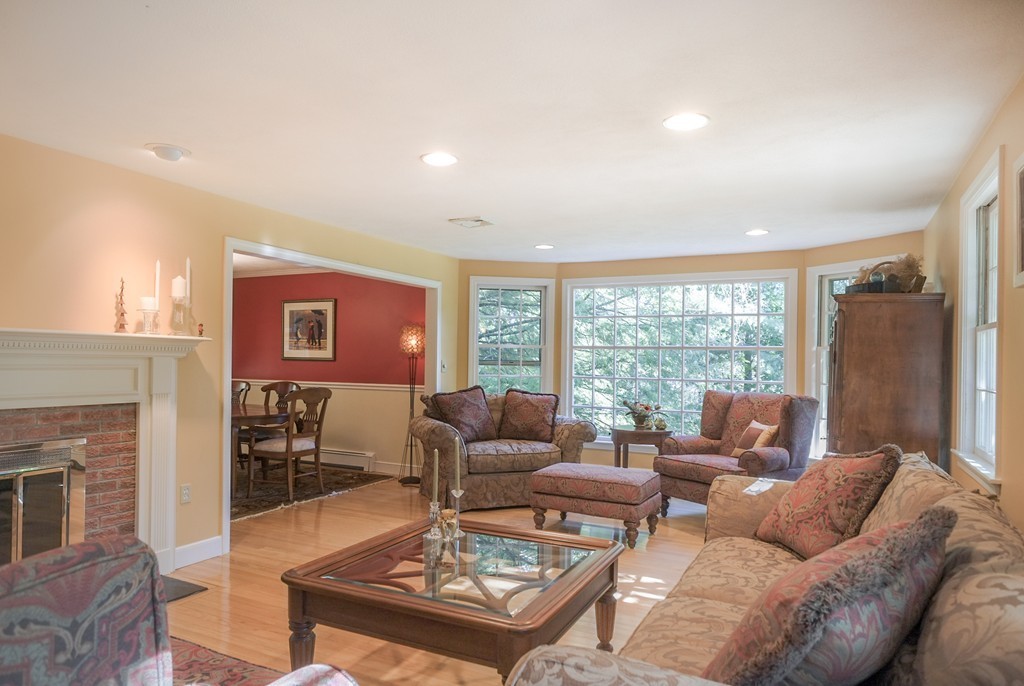 25 Oak Hill Road Wayland, MA 01778 - Photo 5 of 30 a living room with furniture and a floor to ceiling window