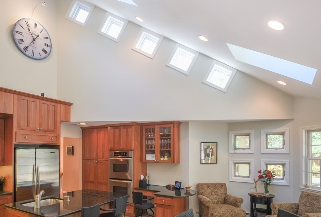 25 Oak Hill Road Wayland, MA 01778 - Photo 9 of 30 a living room with furniture a chandelier fan and wooden floor