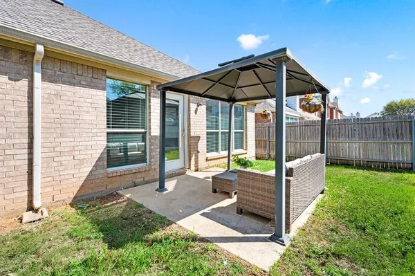 a view of backyard with a garden and deck
