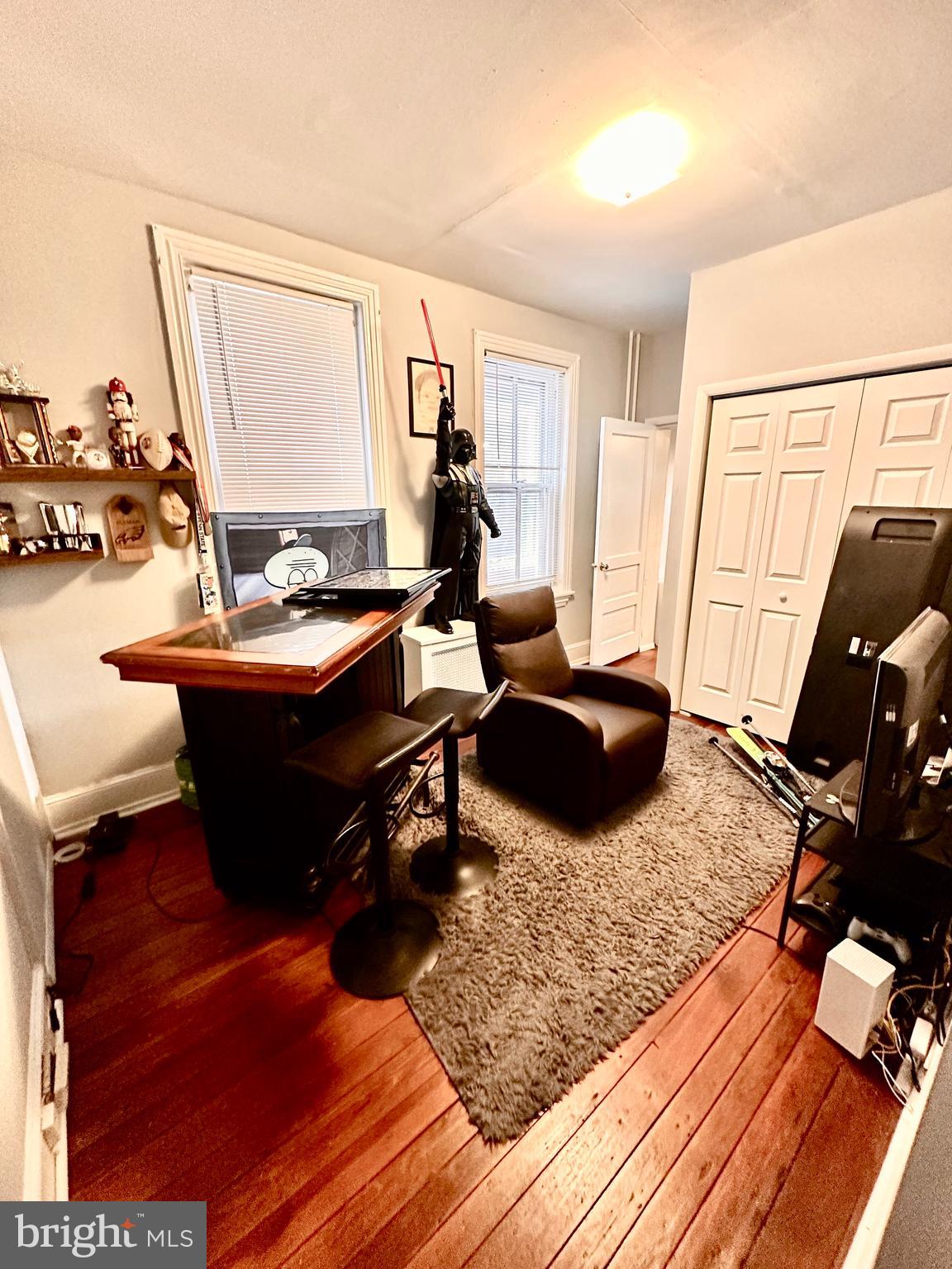 3339 Conrad Street, Unit 1 Philadelphia, PA 19129 - Photo 13 of 13 a living room with a couch a rug and a flat screen tv