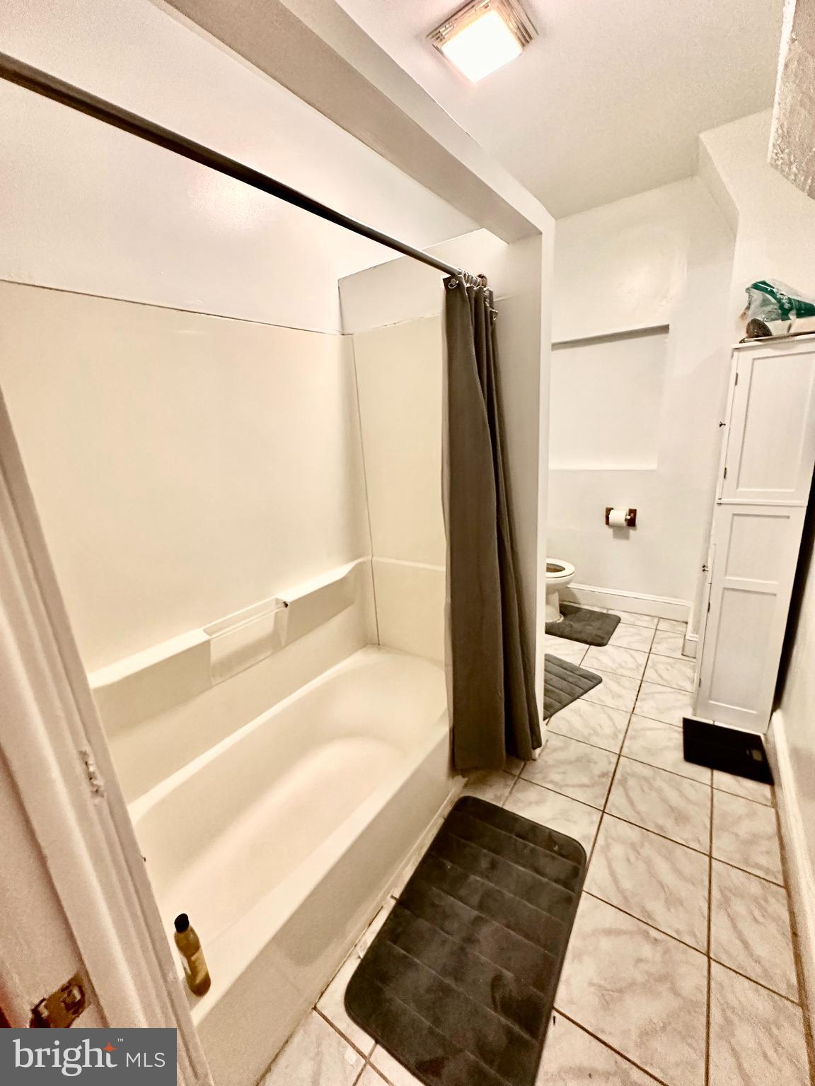 3339 Conrad Street, Unit 1 Philadelphia, PA 19129 - Photo 10 of 13 a bathroom with a tub and a shower