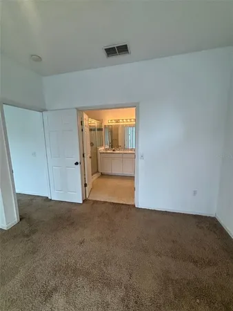 an empty room with a mirror