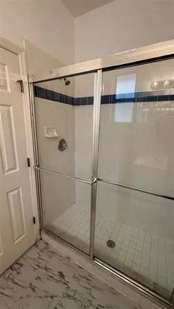 a bathroom with a granite countertop sink a toilet and bathtub