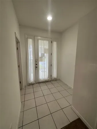 an empty room with a natural light