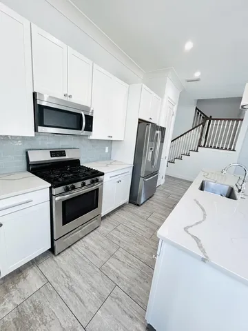 a view of a kitchen and a sink