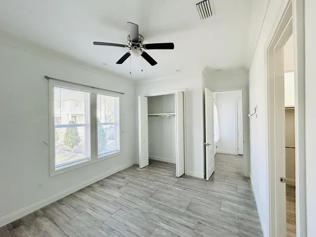 a spacious bathroom with a shower sink and a mirror