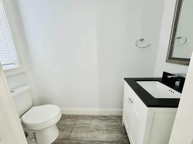 a view of workspace with wooden floor and window