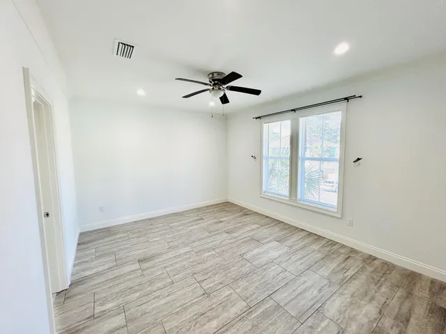 a spacious bathroom with a double vanity sink and a mirror