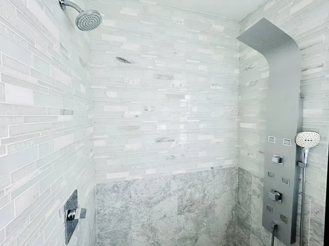 a view of empty room with wooden floor and ceiling fan