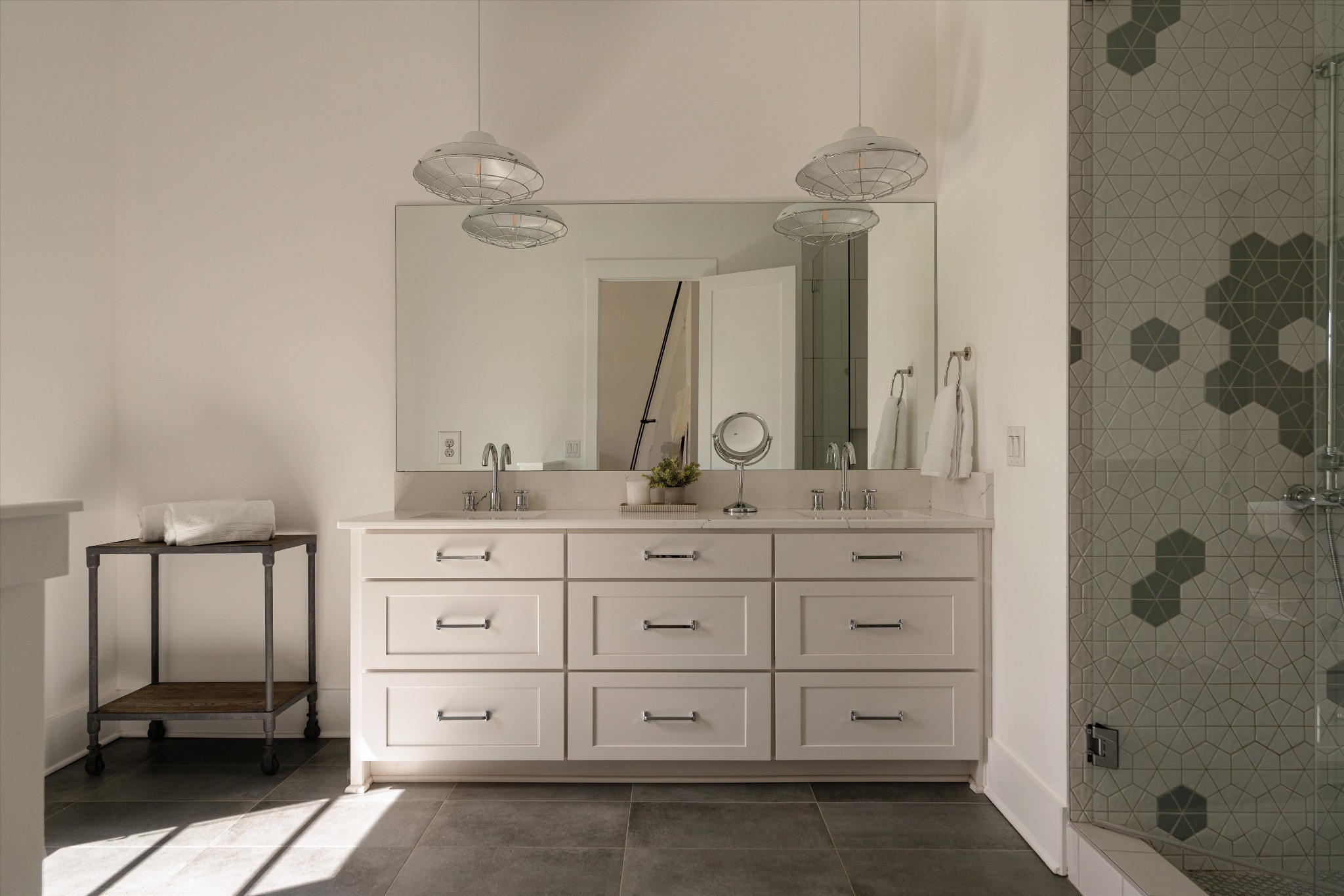 5620 Big East Fork Road Franklin, TN 37064 - Photo 34 of 70 a bathroom with a granite countertop sink a mirror and a shower