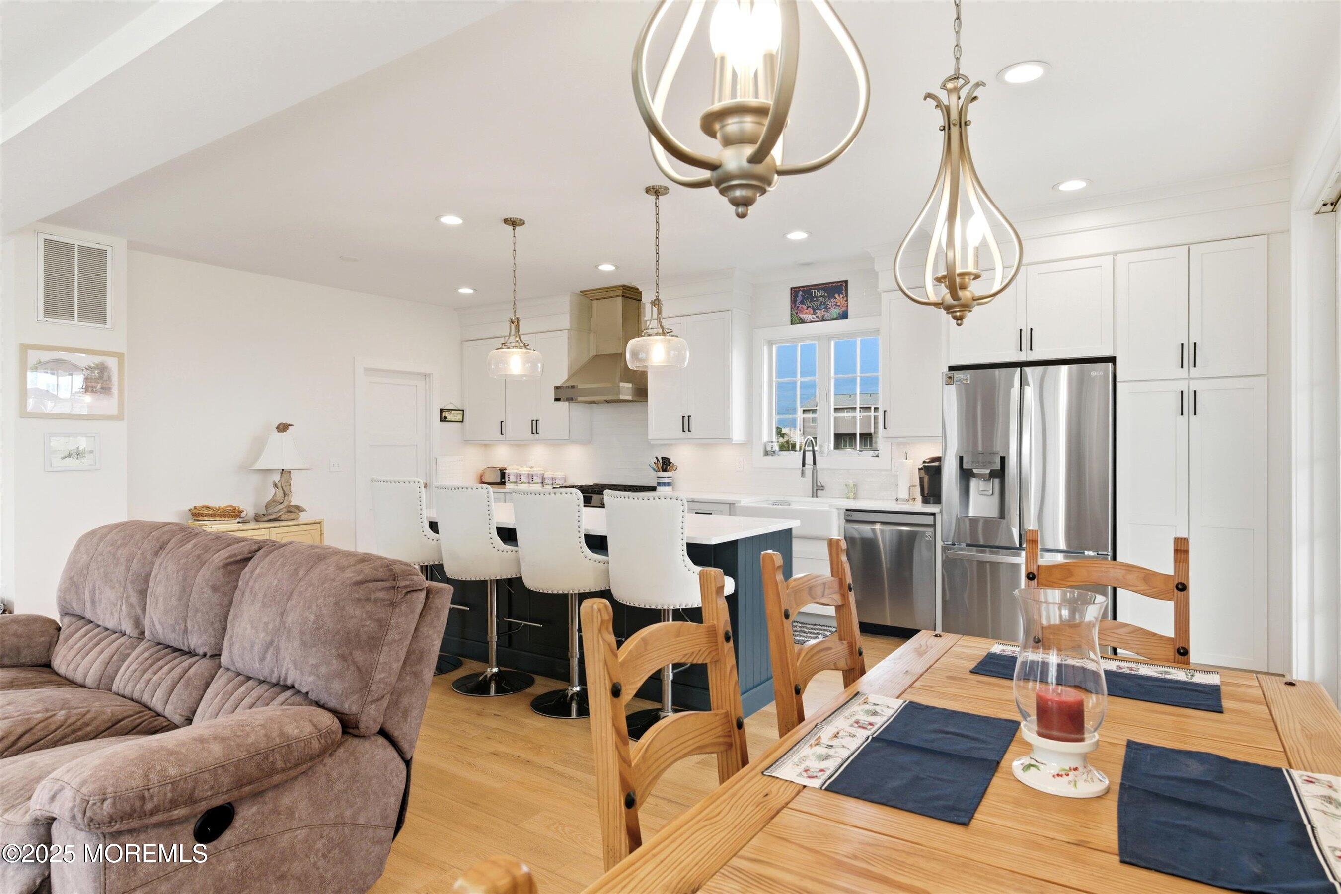 7 East Lavenia Avenue Beach Haven, NJ 08008 - Photo 13 of 48 a living room with furniture kitchen view and a chandelier