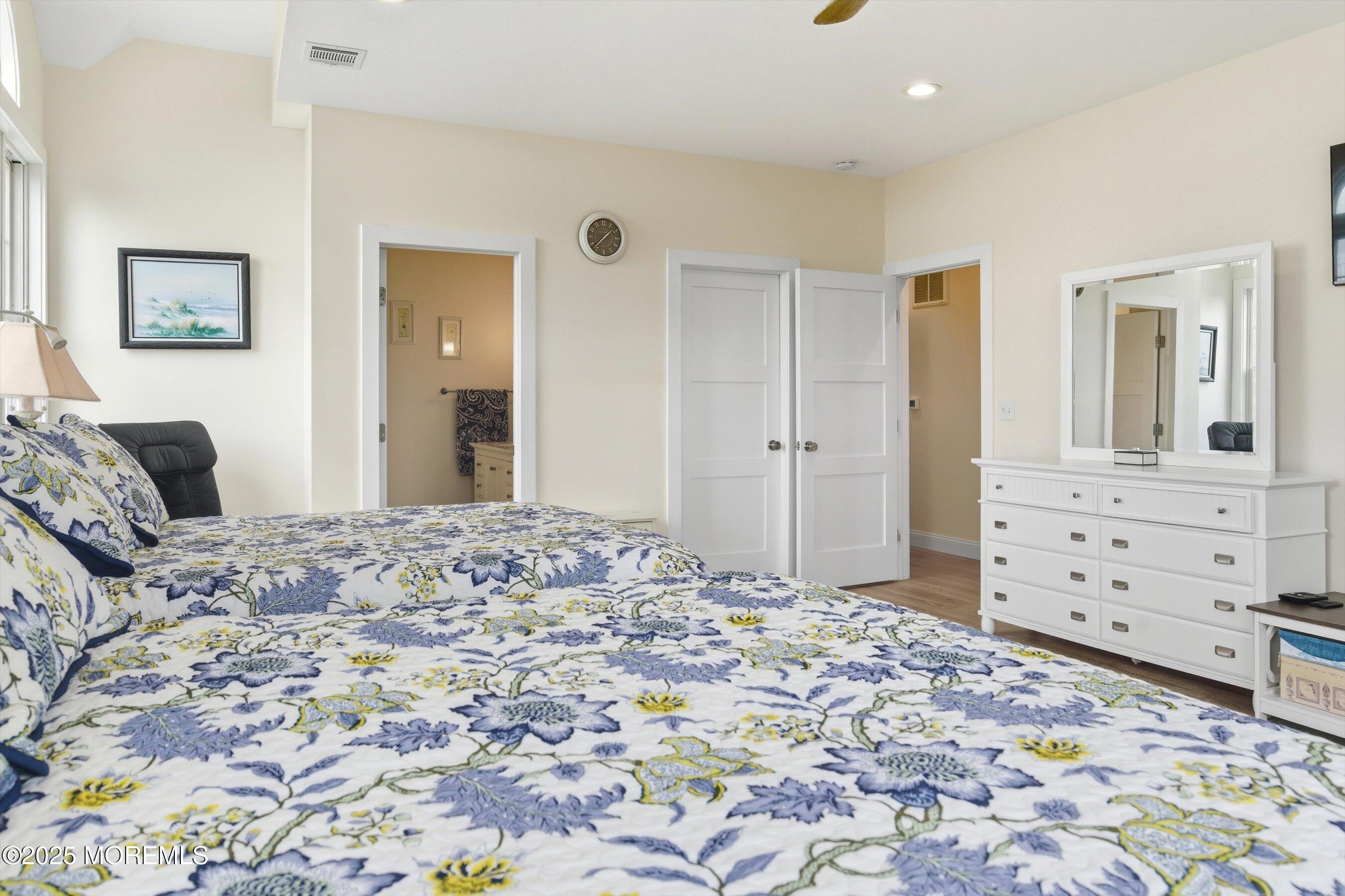 7 East Lavenia Avenue Beach Haven, NJ 08008 - Photo 22 of 48 a bedroom with a bed and a dresser