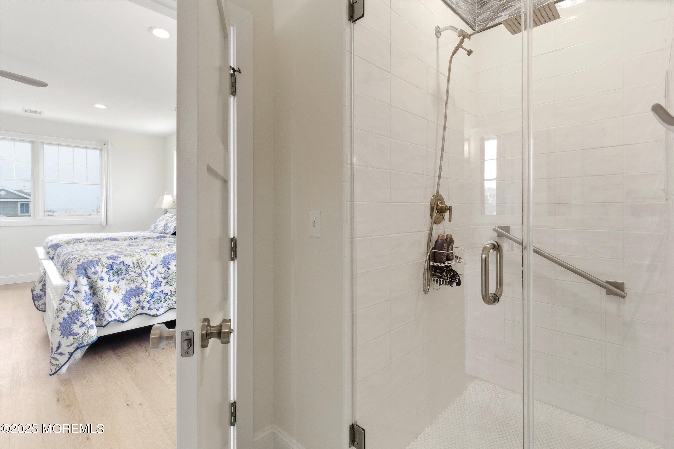 7 East Lavenia Avenue Beach Haven, NJ 08008 - Photo 24 of 48 a view of a bedroom with a bed and a window