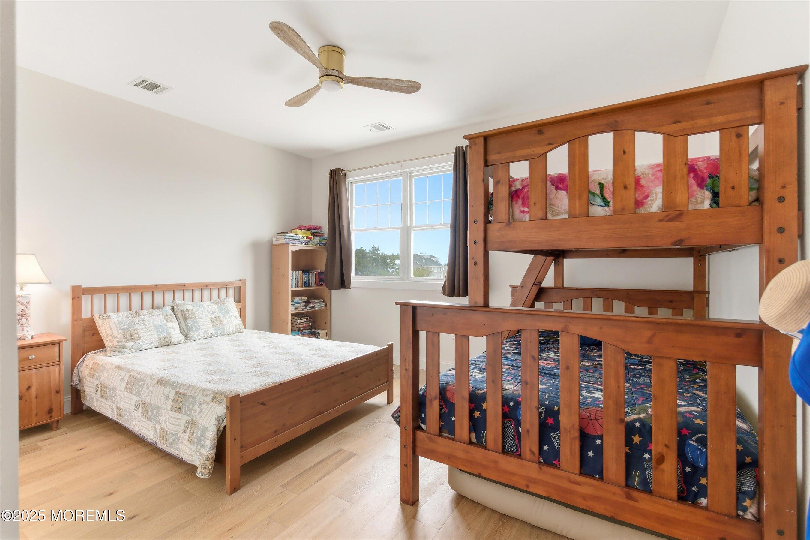 7 East Lavenia Avenue Beach Haven, NJ 08008 - Photo 26 of 48 a bedroom with two beds and a large window