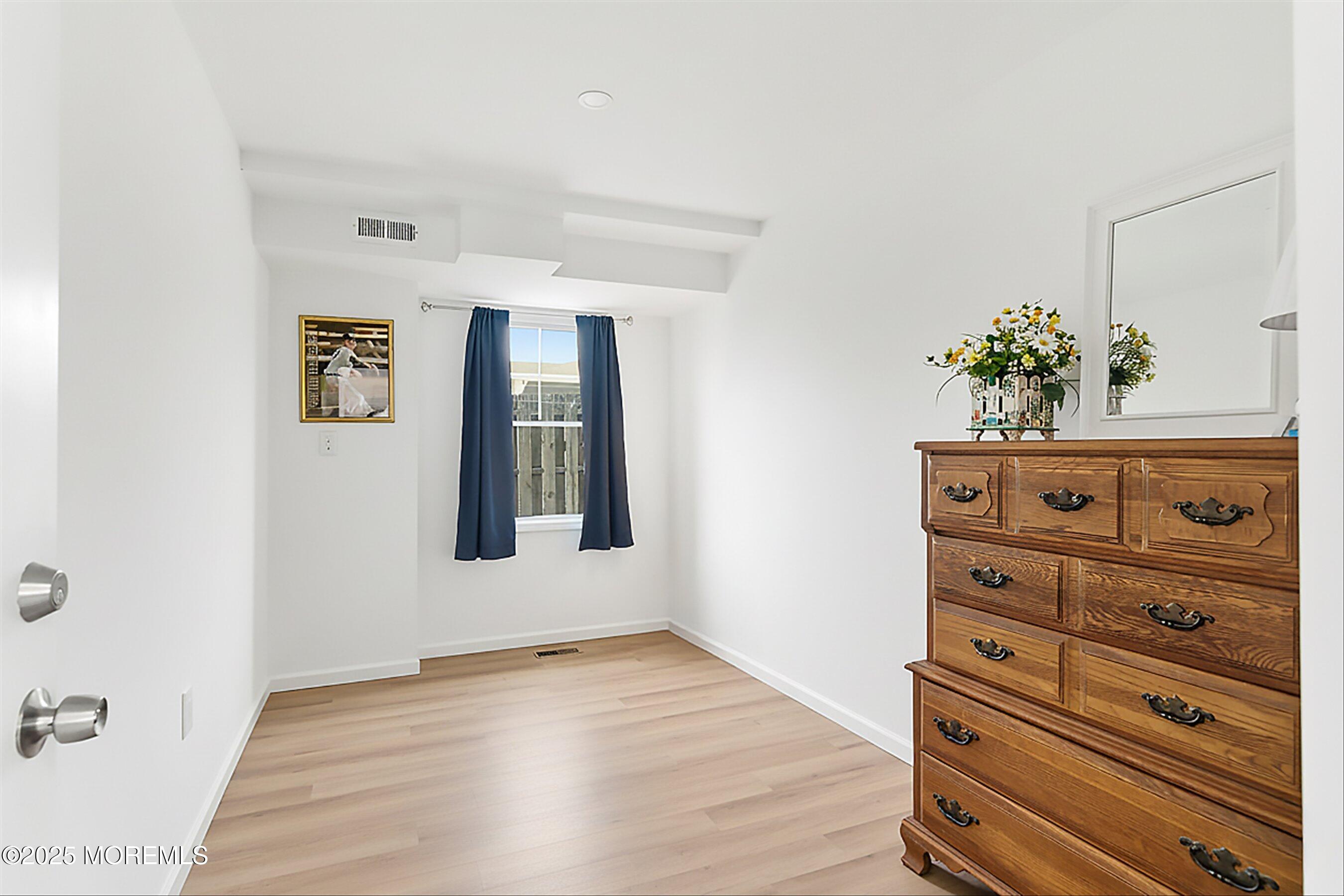 7 East Lavenia Avenue Beach Haven, NJ 08008 - Photo 30 of 48 a view of a dresser with wooden floor