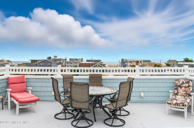 a view of a terrace with furniture and stove