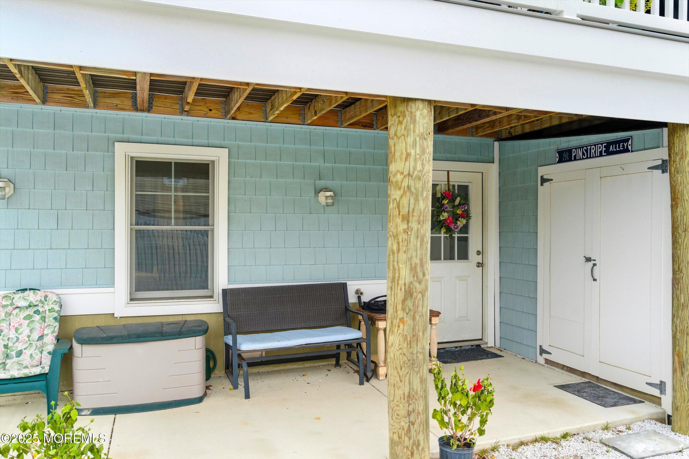7 East Lavenia Avenue Beach Haven, NJ 08008 - Photo 38 of 48 a balcony with furniture and a potted plant