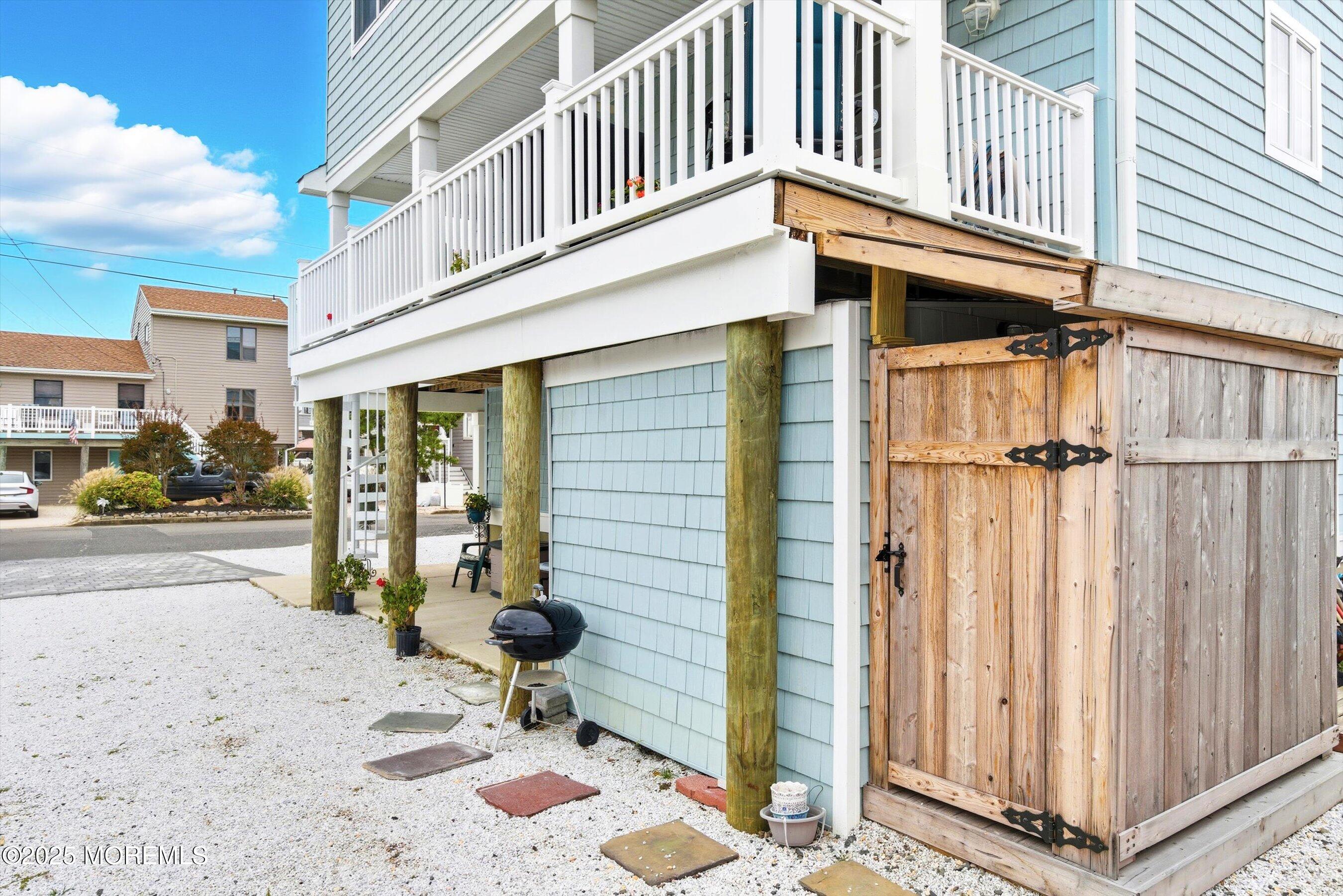 7 East Lavenia Avenue Beach Haven, NJ 08008 - Photo 39 of 48 a backyard of a house with table and chairs