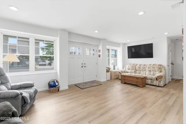 a bedroom with furniture and window