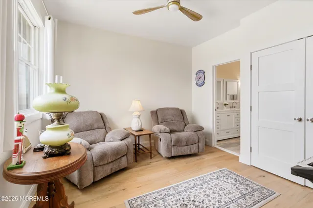 a living room with furniture and a rug