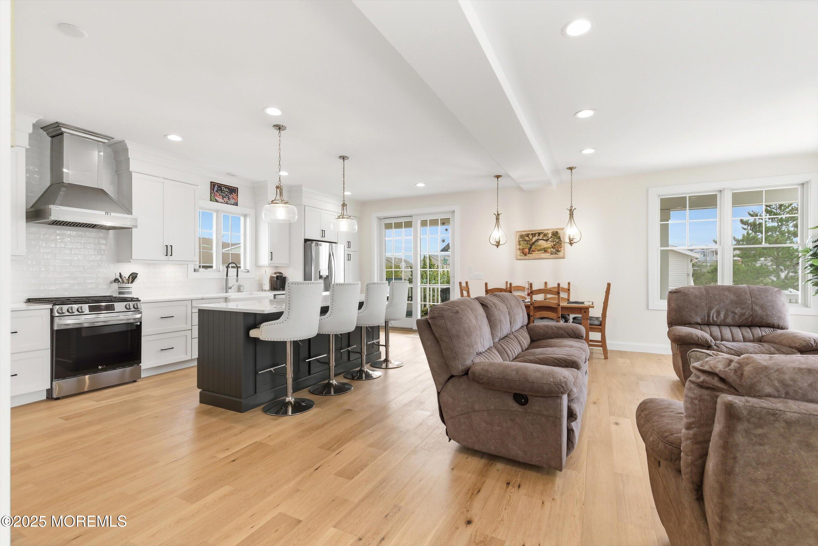 7 East Lavenia Avenue Beach Haven, NJ 08008 - Photo 7 of 48 a living room with furniture and a wooden floor