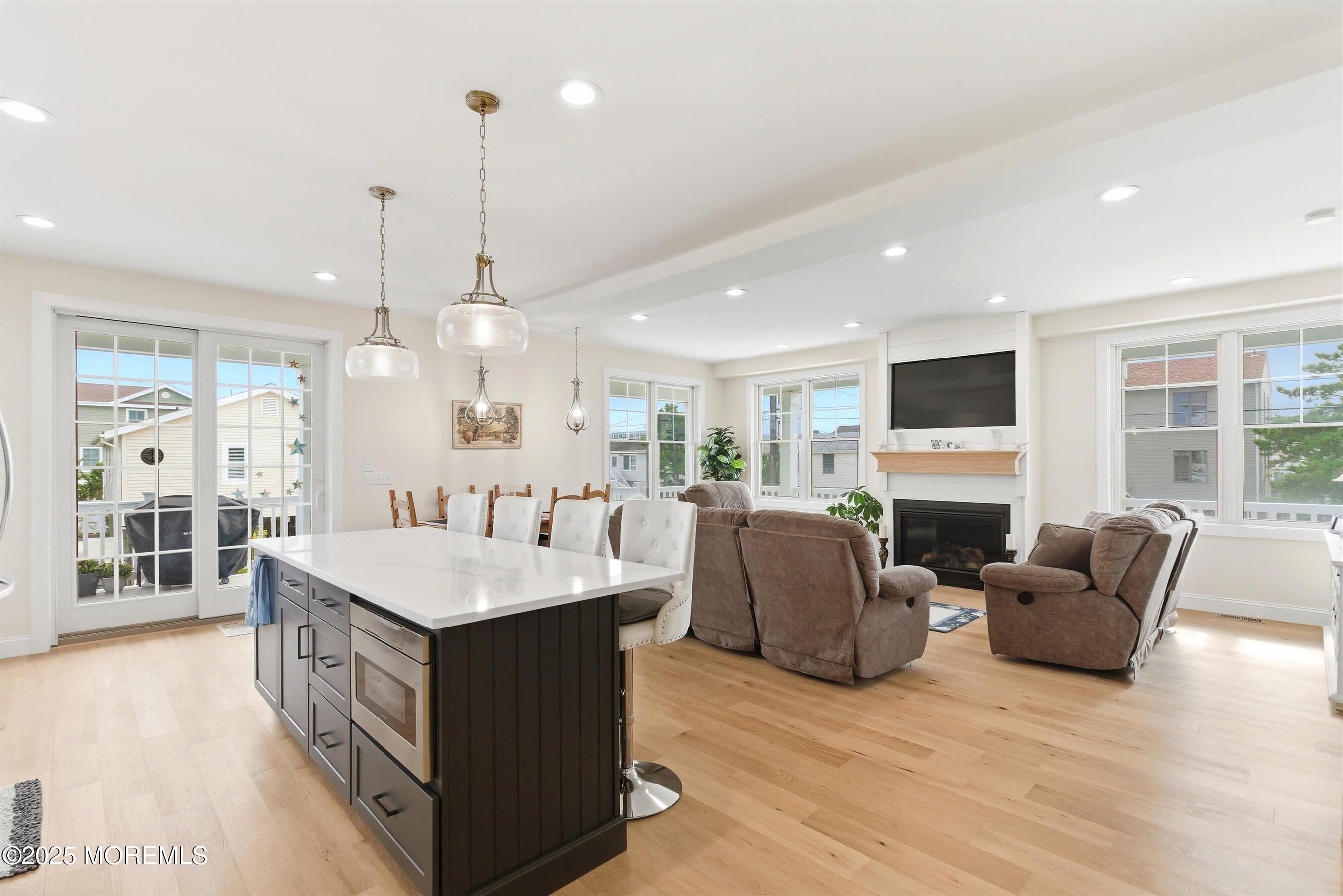 7 East Lavenia Avenue Beach Haven, NJ 08008 - Photo 8 of 48 a large kitchen with stainless steel appliances kitchen island granite countertop a large island in the center