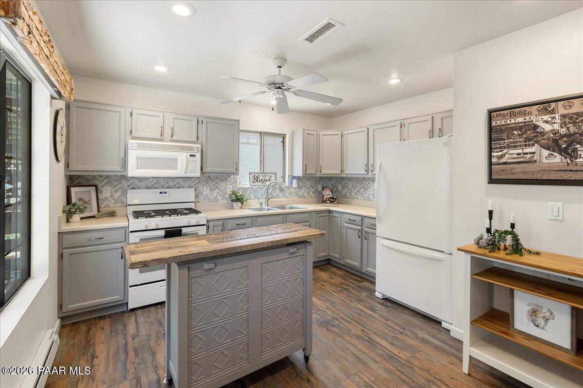 1388 East Pine Ridge Drive Prescott, AZ 86303 - Photo 6 of 16 a kitchen with a sink cabinets stainless steel appliances and a window