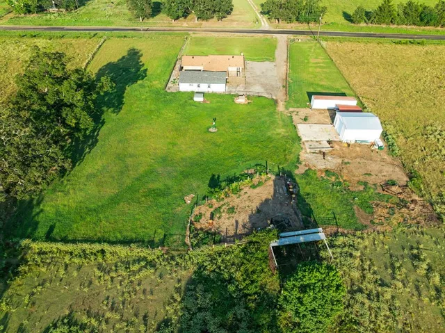 a view of a lake with a yard