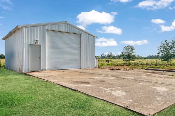 a view of a backyard of the house