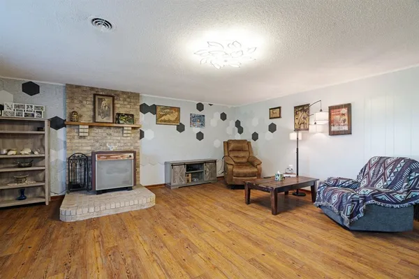 a living room with furniture and flat screen tv