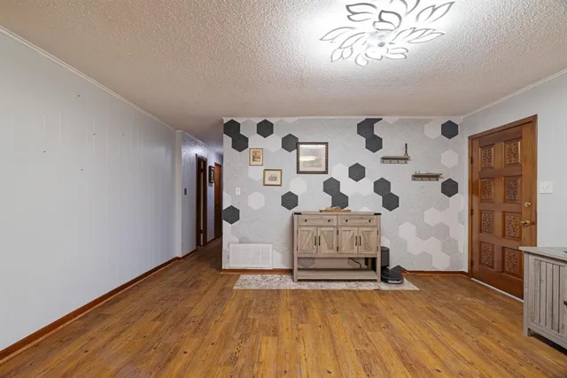 a view of livingroom with hardwood floor and a window