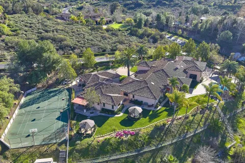 an aerial view of residential house with outdoor space