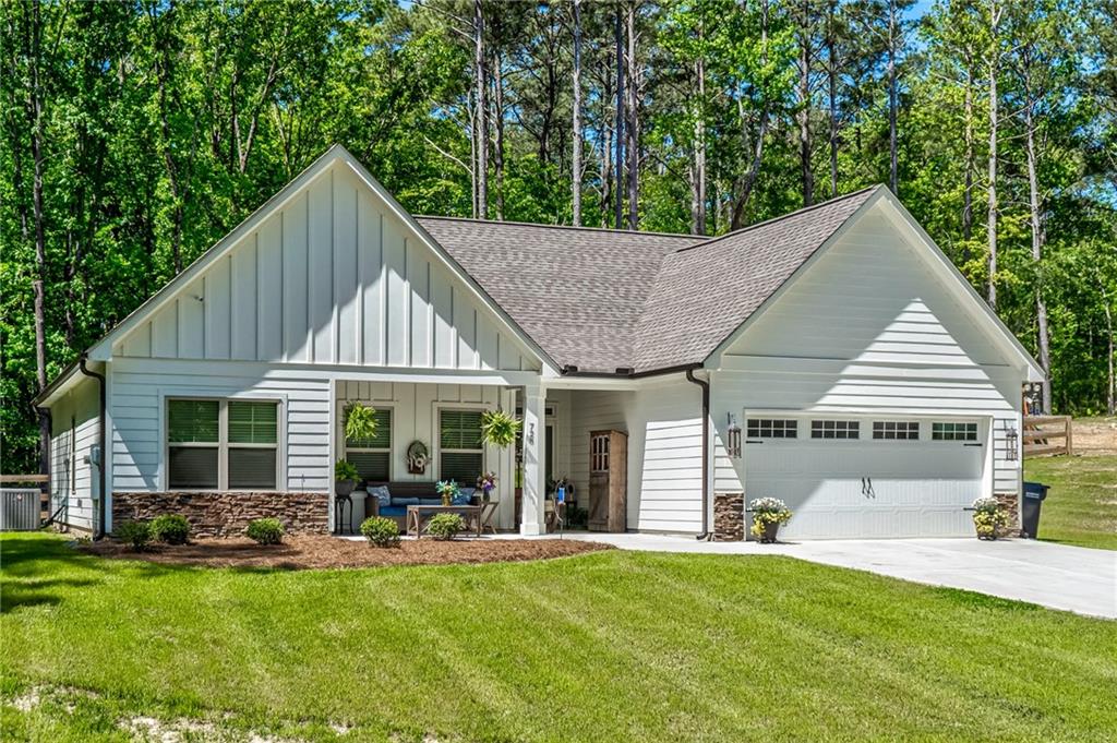 728 Harmony Road Temple, GA 30179 - Photo 1 of 1 a view of a house with a yard patio and a garden
