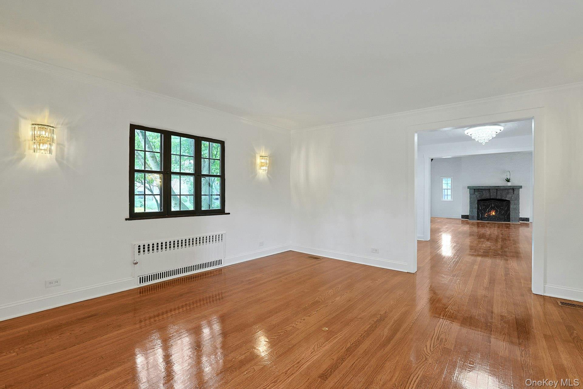 14 Withington Road Scarsdale, NY 10583 - Photo 11 of 41 wooden floor in an empty room with a window