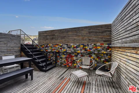 a city view with wooden floor and seating space