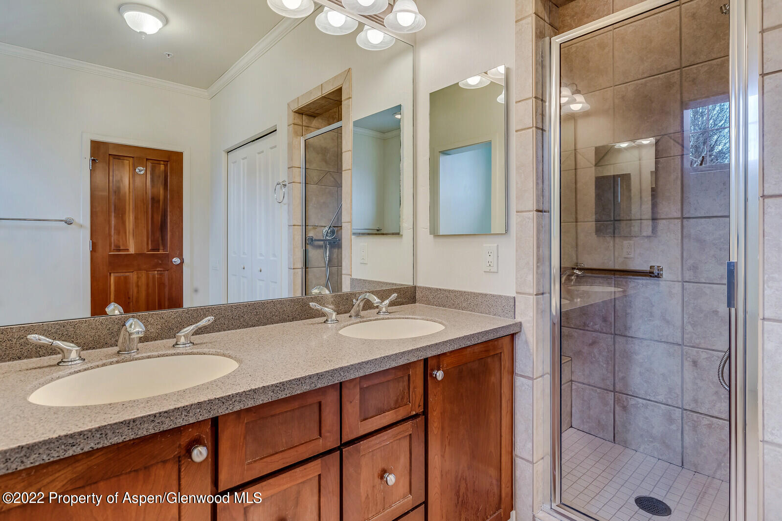 536 Evans Court Basalt, CO 81621 - Photo 11 of 19 a bathroom with a granite countertop sink shower and mirror