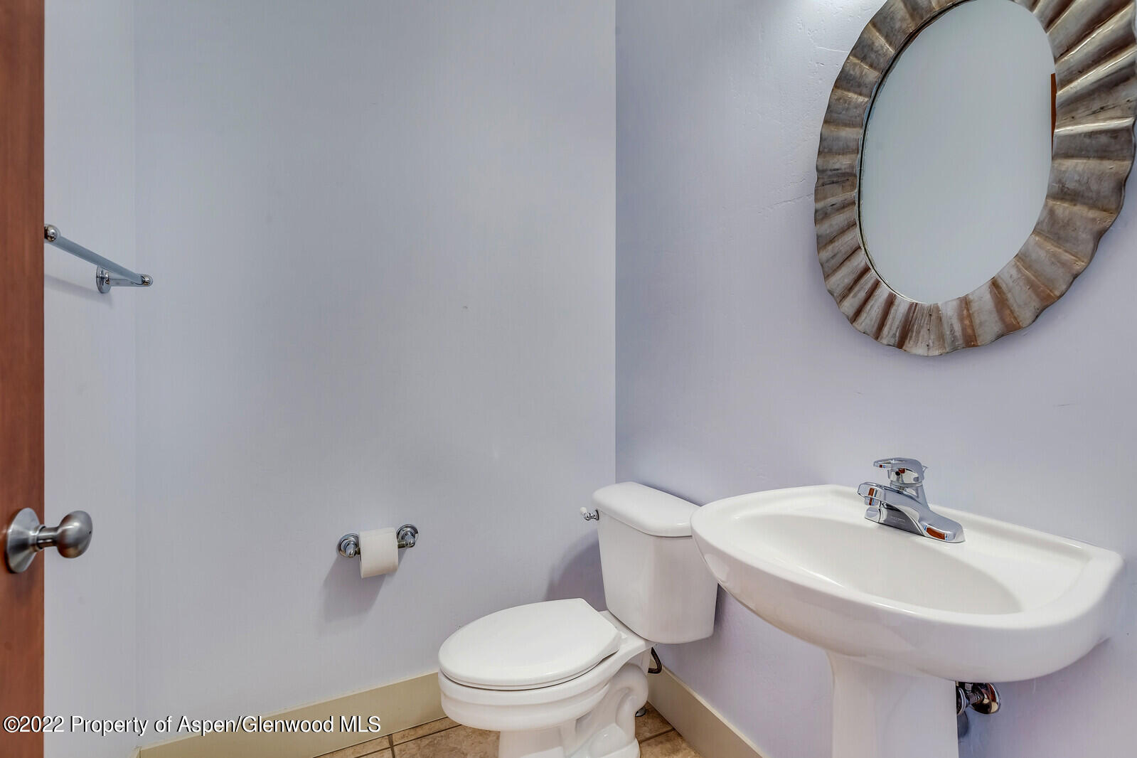 536 Evans Court Basalt, CO 81621 - Photo 12 of 19 a bathroom with a sink a mirror and a toilet