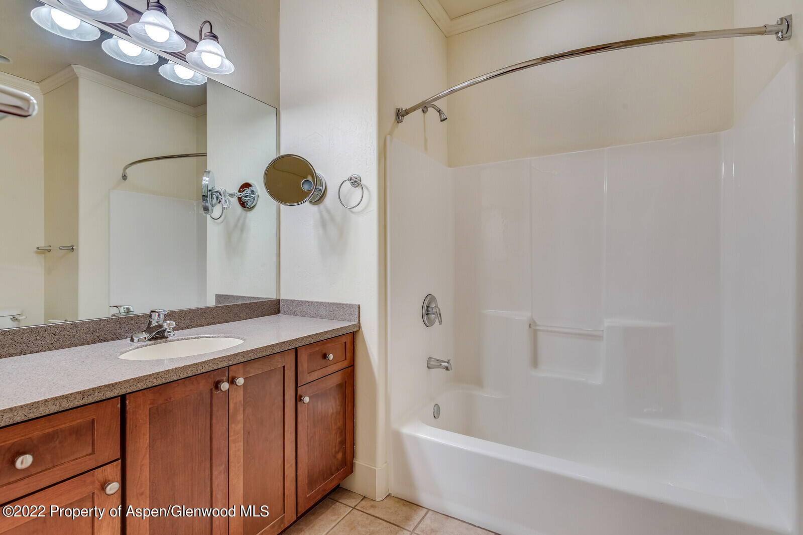 536 Evans Court Basalt, CO 81621 - Photo 15 of 19 a bathroom with a sink a mirror a bathtub and shower