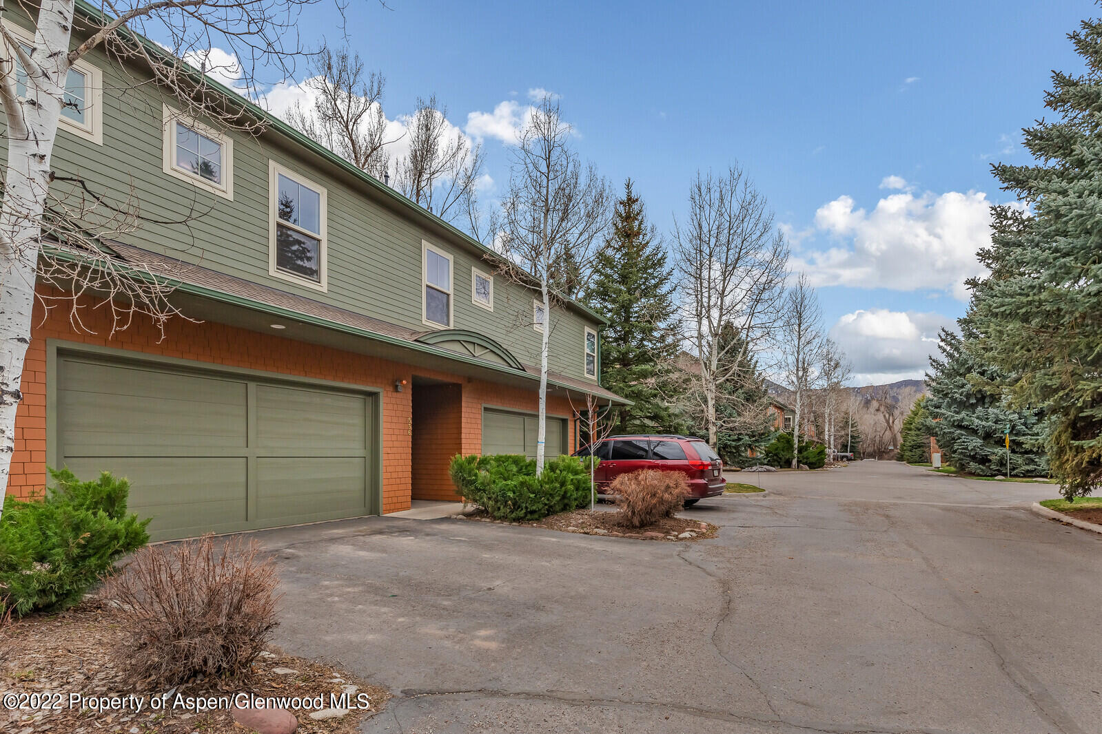 536 Evans Court Basalt, CO 81621 - Photo 2 of 19 a yellow house with sign broad in front of it