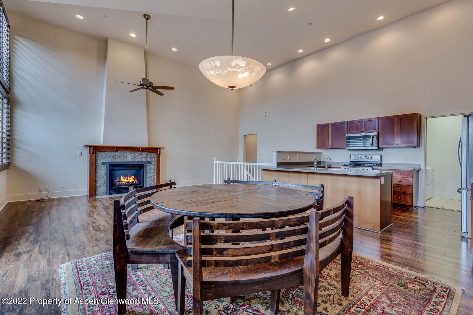 536 Evans Court Basalt, CO 81621 - Photo 4 of 19 a kitchen with a dining table chairs and chandelier